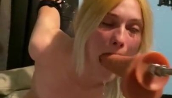 Submissive whore is tied-up and she is getting throat fucked by a machine