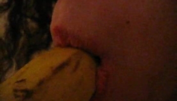 Banana blowjob scene featuring a girl that should probably just get fucked