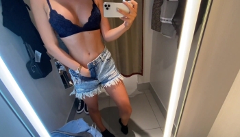Freakishly kinky lady shows off in the dressing room and gives him a handjob