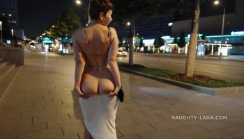 Nude booty beauty showing off her naughty bits while teasing in public